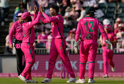 South Africa's bowler Keshav Maharaj, center, celebrates a wicket with his teammates during the second one day international cricket match between South Africa and Australia, in Johannesburg, South Africa, Sunday, Sept. 27, 2026. 
