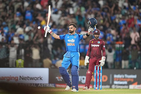 India's Virat Kohli celebrates his century during the first one day international cricket match between India and West Indies in Thiruvananthapuram, India.