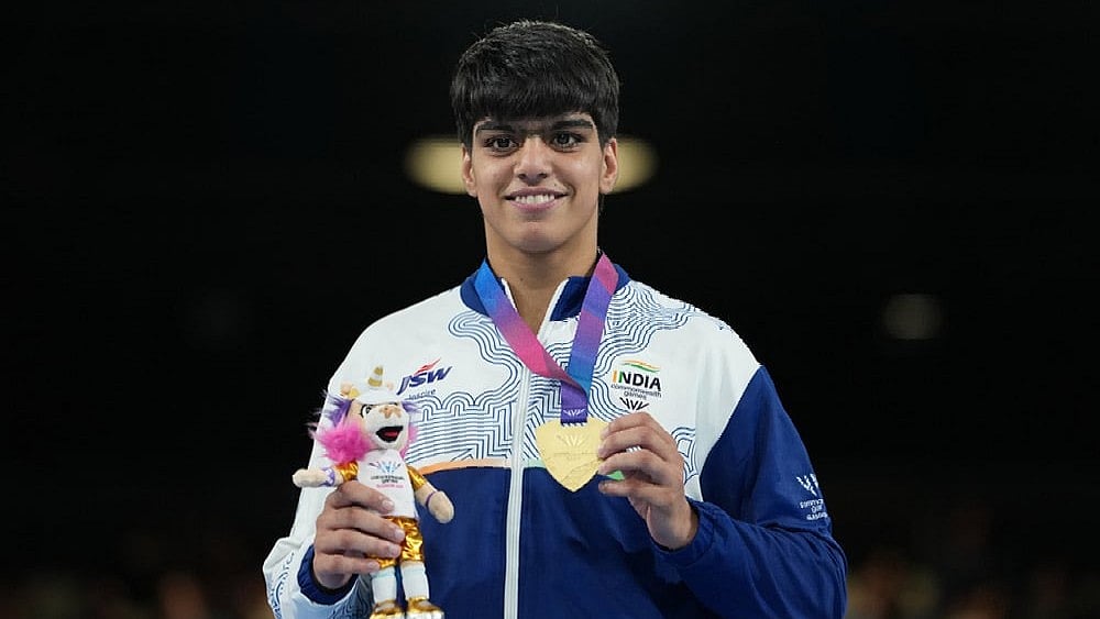 India's Priya Ghanghas celebrates after winning the women's 60kg boxing final at the Commonwealth Games in Glasgow, Scotland. - | Photo: AP/Eranga Jayawardena