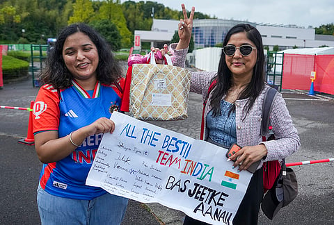 Women hold a banner for team India ahead of the men's cricket Quarterfinal 2 between India and Afghanistan at the 20th Asian Games, at Korogi Athletic Park in Nagoya, Aichi Prefecture, Japan.