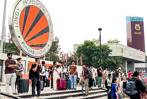Students carry luggage and leave the Lovely Professional University (LPU) campus following protests over claims that a female student was raped by an outsider in the university premises, in Phagwara, Kapurthala district, Punjab, Monday, Sept. 28, 2026. 