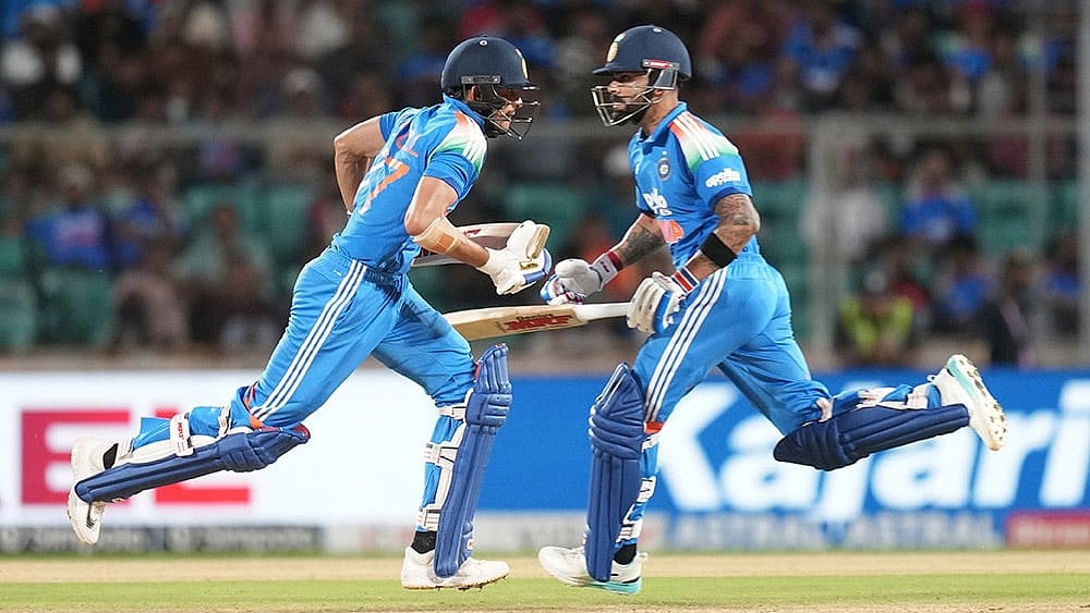 India's captain Shubman Gill, left, and Virat Kohli run between the wickets during the first one day international cricket match between India and West Indies in Thiruvananthapuram, India. - Photo: AP/Rafiq Maqbool