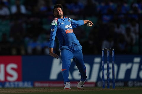India's Kuldeep Yadav bowls a delivery during the first one day international cricket match between India and West Indies in Thiruvananthapuram, India.