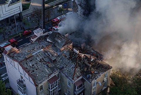 Smoke rises from Dobrobut Hospital and a residential building damaged in a Russian drone strike in central Kyiv, Ukraine, Monday, Sept. 28, 2026. 
