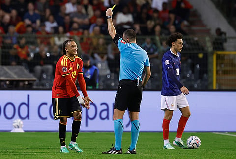 Belgium's Diego Moreira receives a yellow card during the UEFA Nations League soccer match between Belgium and France in Brussels, Belgium, Monday, Sept. 28, 2026. 