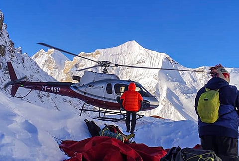 SDRF personnel carry out a rescue operation, on snow-covered mountains, to evacuate trekkers stranded on the Kalindi Pass trek, in Uttarkashi district, Uttarakhand.