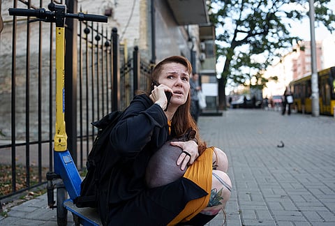 A woman reacts after a Russian drone strike on central Kyiv, Ukraine, Monday, Sept. 28, 2026. 