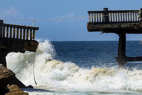 Sea waves crash against the damaged and split Valiyathura Pier, following years of severe wave impact and coastal erosion, in Thiruvananthapuram, Keralam.