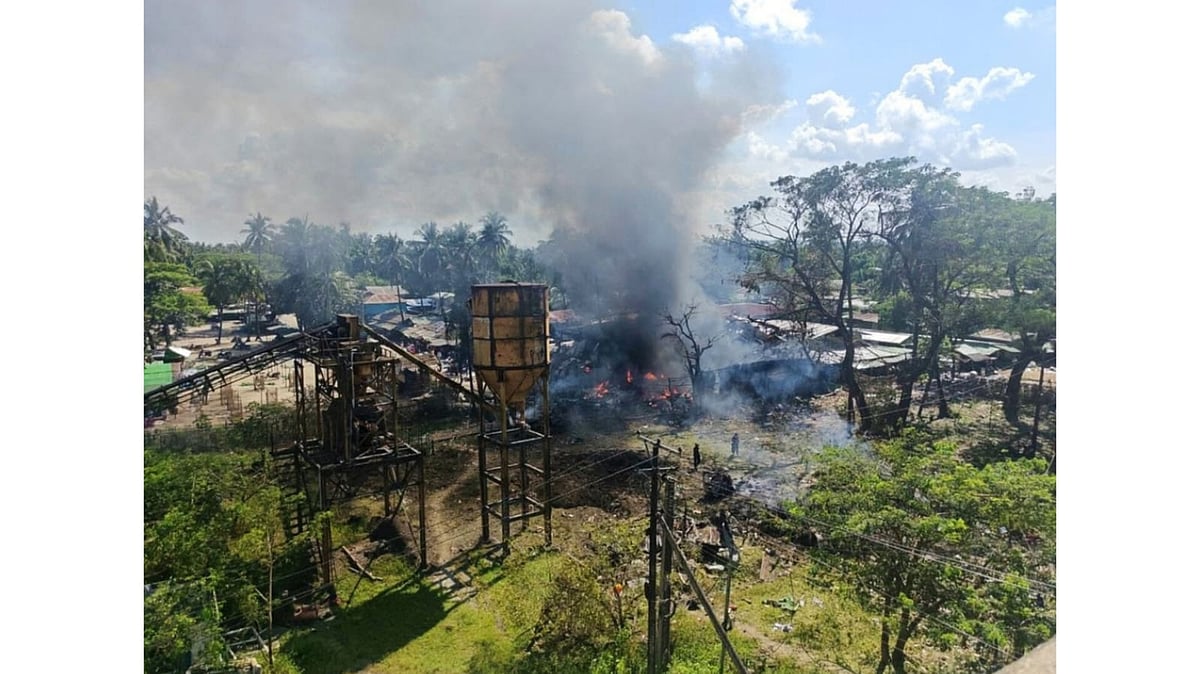 Smoke rises from a market after the area was allegedly hit by the military's airstrike in Kyauktaw township in Rakhine state - Wai Hun Aung via AP