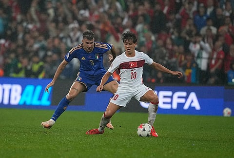 Italy's Matteo Ruggeri, left, and Turkey's Arda Guler challenge for the ball during the UEFA Nations League soccer match between Turkey and Italy in Bursa, Turkey, Monday, Sept. 28, 2026. 