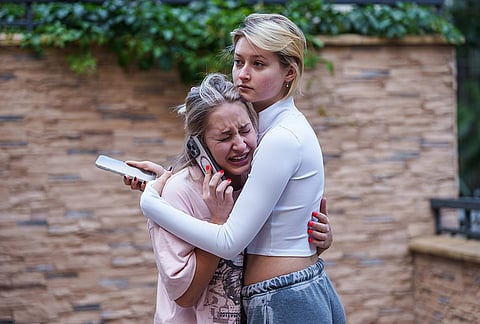 A woman reacts after a Russian drone strike on central Kyiv, Ukraine, Monday, Sept. 28, 2026. 