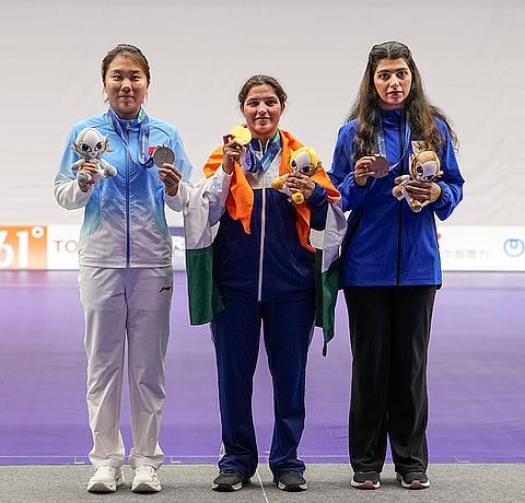 India's Neeru Dhanda, centre, poses with her gold medal during the victory ceremony for the women's trap shooting individual event at the 20th Asian Games 2026, in Nagoya, Japan, Tuesday, Sept. 29, 2026. China's Sun Yunong, left, and Kuwait's Hajar Abdulmalik are also seen. 