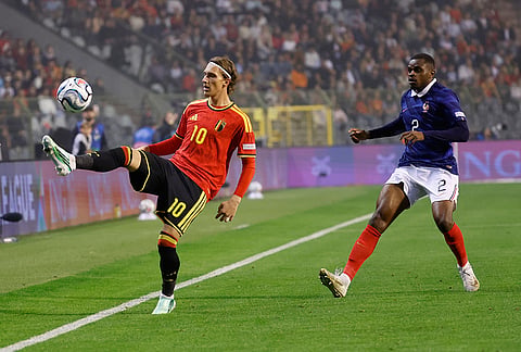 Belgium's Mika Godts controls the ball in front pf France's Pierre Kalulu during the UEFA Nations League soccer match between Belgium and France in Brussels, Belgium, Monday, Sept. 28, 2026. 
