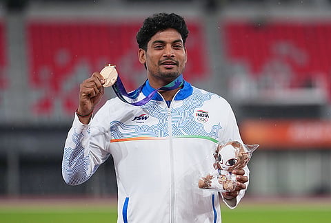 Bronze medalist Rohit Yadav of India poses on the podium following the men's javelin throw at the Asian Games in Nagoya, Japan, Tuesday, Sept. 29, 2026. 