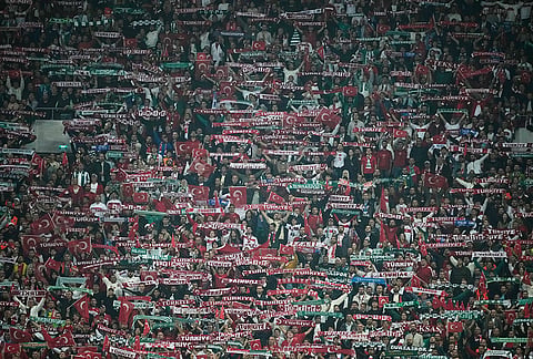 Turkey's fans support their team during the UEFA Nations League soccer match between Turkey and Italy in Bursa, Turkey, Monday, Sept. 28, 2026. 