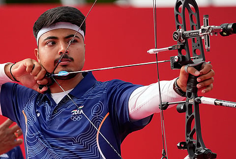 Kushal Dalal of India lines up a shot in the compound men's team semifinal in archery between South Korea and India, at the Asian Games in Okazaki, Japan, Wednesday, Sept. 30, 2026. 