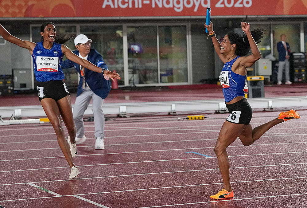 India s Vithya Ramraj, right, reacts as she crosses the finish line with teammate Poovamma Machettira in the womens 4 x 400m relay final at the Asian Games in Nagoya, Japan, Tuesday, Sept. 29, 2026. 
