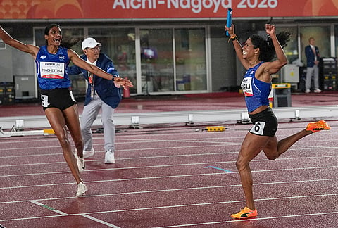 India' s Vithya Ramraj, right, reacts as she crosses the finish line with teammate Poovamma Machettira in the women's 4 x 400m relay final at the Asian Games in Nagoya, Japan, Tuesday, Sept. 29, 2026. 
