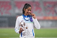 Nineteen-Year-Old Pooja Singh Wins Bronze In Women's High Jump To End India's 24-Year Drought At Asian Games 2026 | Photo: AP/Lee Jin-man
: Bronze medalist Pooja of India poses on the podium following the women's high jump final at the Asian Games in Nagoya, Japan, Tuesday, Sept. 29, 2026.