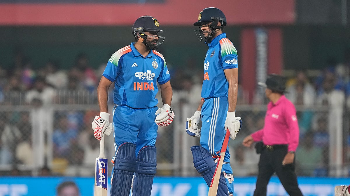 India's captain Shubman Gill, right, talks with his batting partner Rohit Sharma during the second one-day international cricket match between India and West Indies in Guwahati, India, Wednesday, Sept. 30, 2026 - (AP Photo/ Anupam Nath)