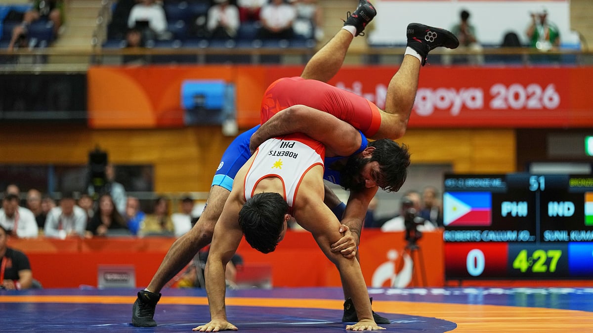 India's Sunil Kumar, right, and Philippines's Callum Johnston Roberts compete in their men's greco-roman 87kg bronze medal wrestling match at the Asian Games in Nagoya, Japan, Wednesday, Sept. 30, 2026. - (AP Photo/Lee Jin-man)