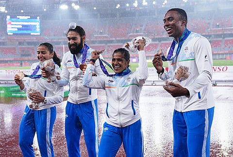Bronze medalist team India pose with their medals following the 4x100-meter relay mixed final at the Asian Games in Nagoya, Japan, Tuesday, Sept. 29, 2026. 