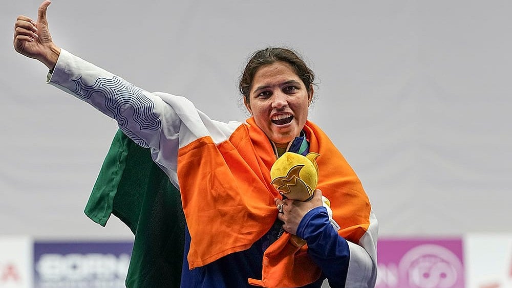 India's Neeru Dhanda holds the event mascot during the victory ceremony for the women's trap shooting individual event at the 20th Asian Games 2026, in Nagoya, Japan. - | Photo: PTI/Atul Yadav