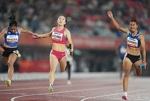 China's Chen Yujie, centre, anchors her team to a win in the 4x100-meter relay mixed final ahead of Thailand's Jirapat Khanonta, right, and India's Harita Bhadra, left, at the Asian Games in Nagoya, Japan, Tuesday, Sept. 29, 2026. 