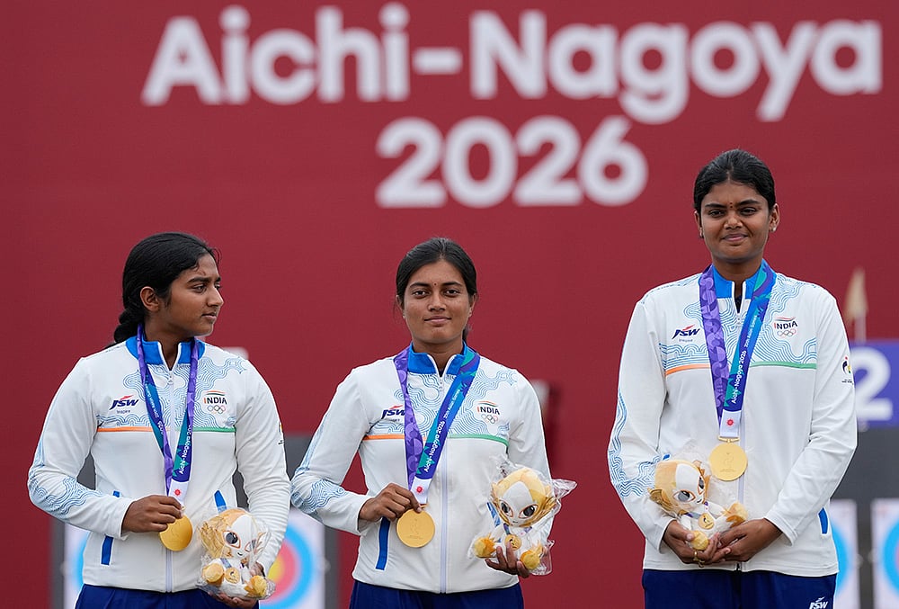 Gold medalists, India team members celebrate on the podium during the medal ceremony for the compound women's team in archery at the Asian Games in Okazaki, Japan, Wednesday, Sept. 30, 2026.  - | Photo: AP/Eugene Hoshiko