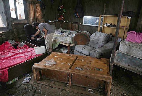 A resident retrieves belongings from their home that was damaged by Hurricane Polo in Puerto San Carlos, Baja California Sur state, Mexico, Tuesday, Sept. 29, 2026. 
