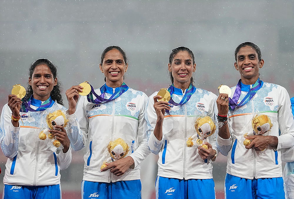 India’s Kiran, Prachi, Poovama Machettira, and Vithya Ramraj pose for photographs after winning gold medal in the women's 4 x 400 relay final in the ongoing Asian Games 2026, in Nagoya, Japan, Tuesday, Sept. 29, 2026. 
 - | Photo: PTI/Arun Sharma