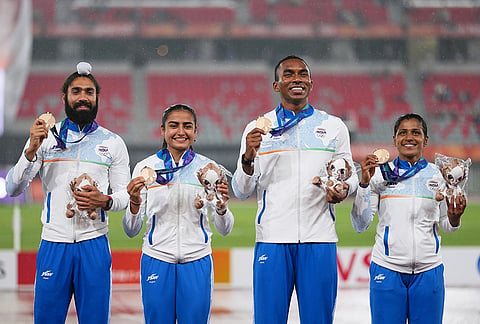 Bronze medalist team India pose on the podium following the 4x100-meter relay mixed final at the Asian Games in Nagoya, Japan, Tuesday, Sept. 29, 2026. 