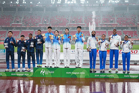 Gold medalist, team China, centre, silver medalist, team Thailand, left, and bronze medalist team India pose on the podium following the 4x100-meter relay mixed final at the Asian Games in Nagoya, Japan, Tuesday, Sept. 29, 2026. 