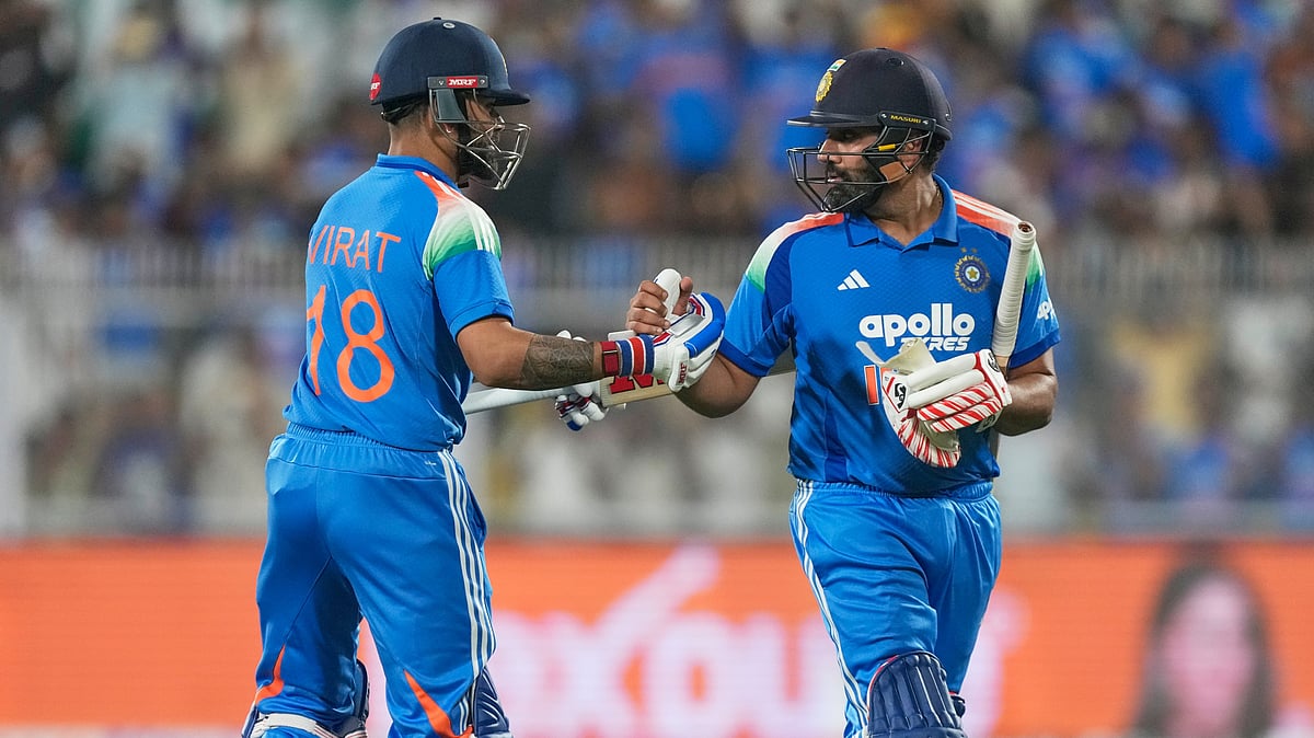 India's Rohit Sharma, right, shake hands with Virat Kohli as he leaves the ground after losing his wicket during the second one-day international cricket match between India and West Indies in Guwahati, India, Wednesday, Sept. 30, 2026 - (AP Photo/ Anupam Nath)
