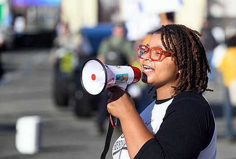 An AI protester speaks into a megaphone outside the OpenAI DevDay 2026 conference in San Francisco, Tuesday, Sept 29, 2026. 
