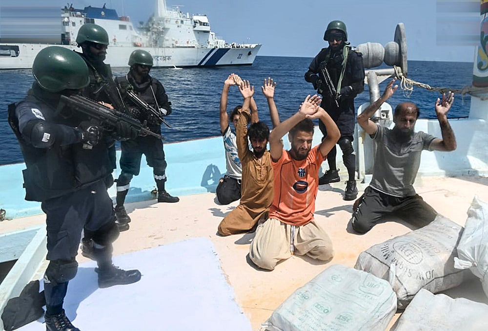 Security personnel detain five Pakistani nationals and seized 526 kg of methamphetamine and heroin valued at more than Rs 3,000 crore from an Iranian boat in the Arabian Sea, after a joint operation by the Indian Coast Guard (ICG) and Gujarat Anti-Terrorism Squad (ATS) near Lakshadweep. 
 - | Photo: @IndiaCoastGuard/X via PTI 