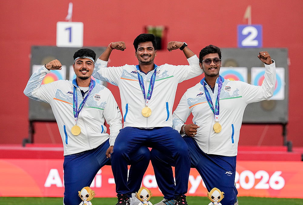 Gold medallist, from left, India's Kushal Dalal, Sahil Jadhav and Ganesh Mani Ratnam Thirumuru pose for photographers during the medal ceremony for the compound men's team archery event at the 20th Asian Games, in Nagoya, Japan, Wednesday, Sept. 30, 2026.  - | Photo: PTI/Arun Sharma