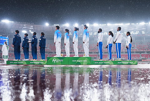 Gold medalist, team China, centre, silver medalist, team Thailand, left, and bronze medalist team India stand on the podium for the anthem following the 4x100-meter relay mixed final at the Asian Games in Nagoya, Japan, Tuesday, Sept. 29, 2026. 