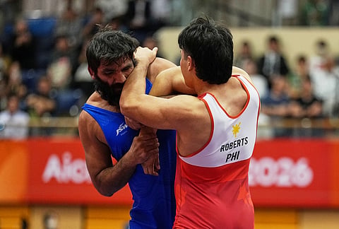 India's Sunil Kumar, left, and Philippines's Callum Johnston Roberts compete in their men's greco-roman 87kg bronze medal wrestling match at the Asian Games in Nagoya, Japan, Wednesday, Sept. 30, 2026. 