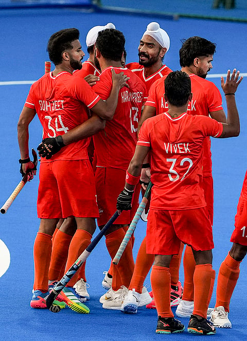 India's Sukhjeet Singh, 34, celebrates a goal with captain Harmanpreet Singh, 13, and others during a men's semifinal hockey match between India and Pakistan, at the ongoing 20th Asian Games, in Kakamigahara, Japan, Thursday, Oct. 1, 2026.