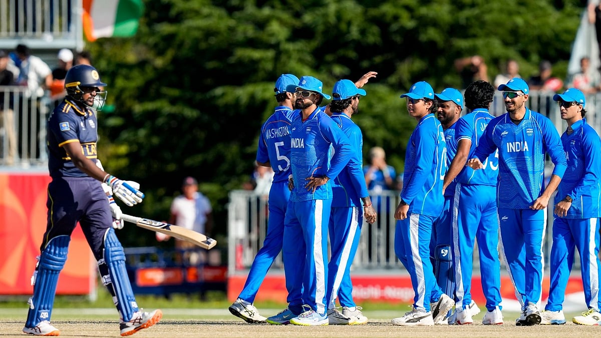 Indian cricketers celebrate a Sri Lankan wicket during Asian Games 2026 semifinal.  - PTI