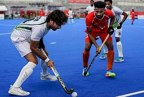 India's Sukhjeet Singh, right, vies for ball control with Pakistan's Ahmad Nadeem during the men's hockey semi-final match between India and Pakistan at the 20th Asian Games Aichi-Nagoya 2026, in Kakamigahara, Japan, Thursday, Oct. 1, 2026. 