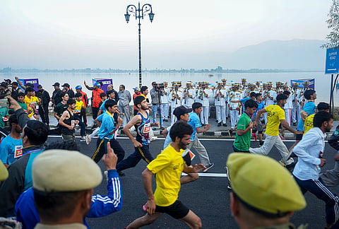 Runners participate in the Kashmir Marathon Run for Unity, organised by the Jammu and Kashmir Police, in Srinagar, Jammu and Kashmir.