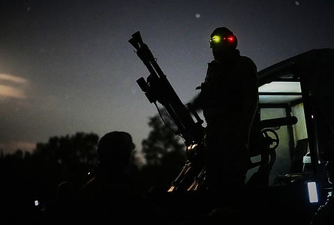 A Ukrainian air defense soldier gets ready to repel Russia's drone attack in Kyiv, Ukraine, Saturday evening, Sept. 19, 2026. 
