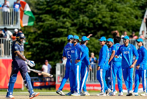 India's Jasprit Bumrah celebrates with teammates after taking the wicket of Sri Lanka's Sineth Jayawardena during the second semifinal T20I cricket match between India and Sri Lanka, at the 20th Asian Games, in Nisshin, Japan, Thursday, Oct. 1, 2026. 