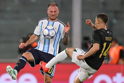 Argentina's Alexis Mac Allister and Bolivia's Robson Tome de Araujo battle for the ball during an international friendly soccer match in Cordoba, Argentina, Wednesday, Sept. 30, 2026. 