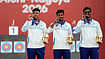 | Photo: AP/Eugene Hoshiko : India's Sahil Rajesh Jadhav, center, Kushal Dalal, left, and Ganesh Mani Ratnam Thirumuru, right, pose with the gold medals on the podium after the compound men's team final in archery at the Asian Games in Okazaki, Japan, Wednesday, Sept. 30, 2026.