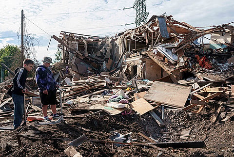 Boys look at a residential house destroyed in a Russian missile strike on Vyshhorod, Kyiv region, Ukraine, Wednesday, Sept. 30, 2026. 
