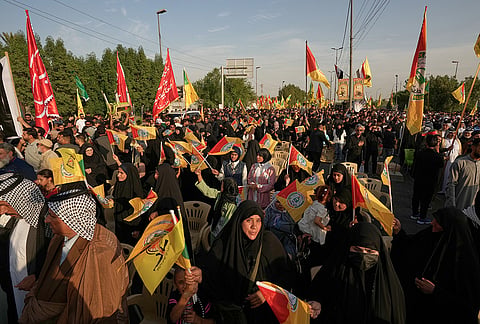 People gather during celebrations marking the complete withdrawal of U.S. troops from Iraq, in Baghdad, Iraq, Wednesday, Sept. 30, 2026. 
