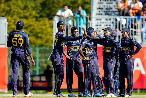 Sri Lanka's Lasith Croospulle celebrates with teammates after taking the wicket of India's Axar Patel during the second semifinal T20I cricket match between India and Sri Lanka, at the 20th Asian Games, in Nisshin, Japan, Thursday, Oct. 1, 2026. 